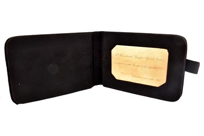 Lot 42 - A continental yellow metal 750 marked presentation plaque