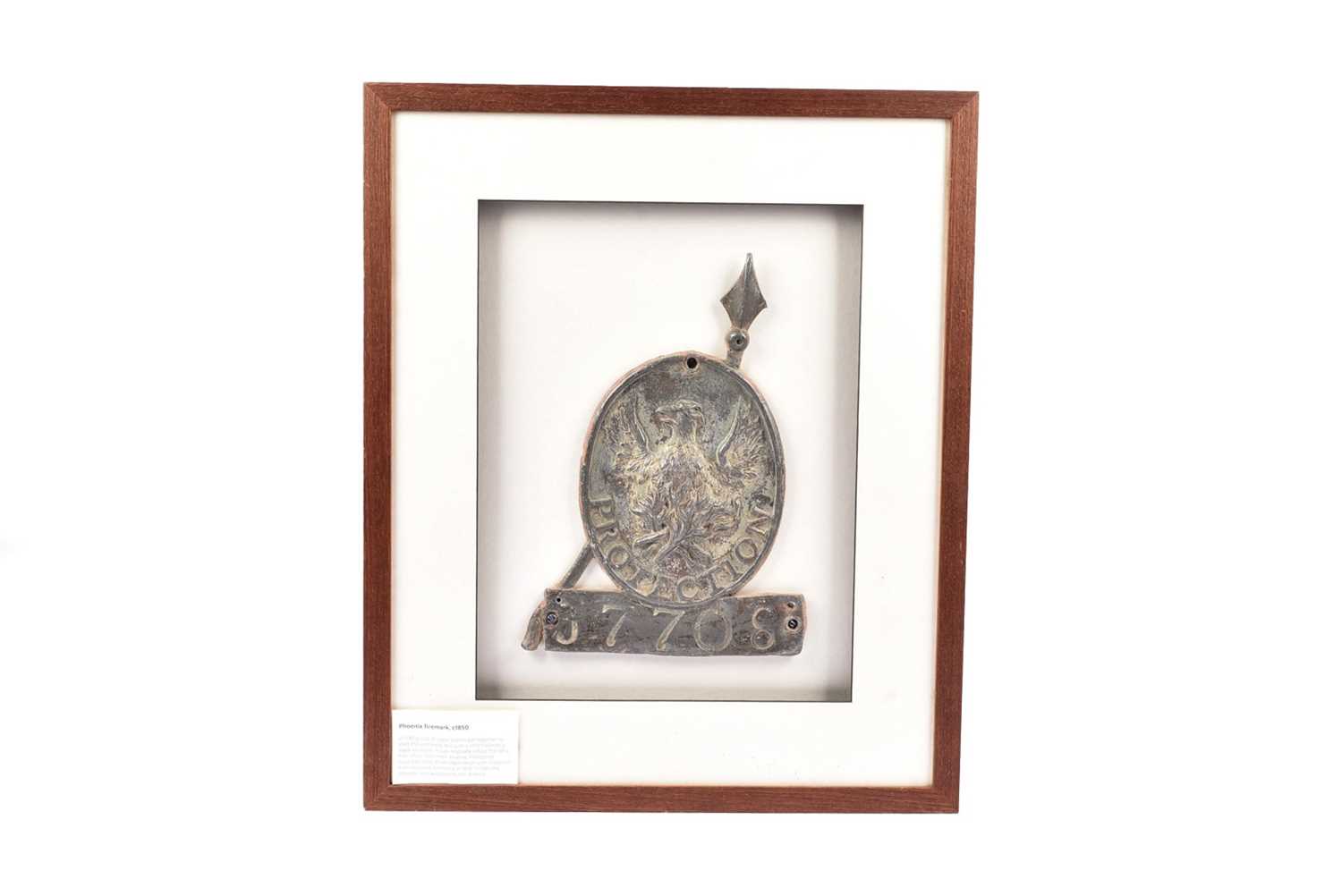 Lot 70 - A framed and mounted lead Phoenix firemark