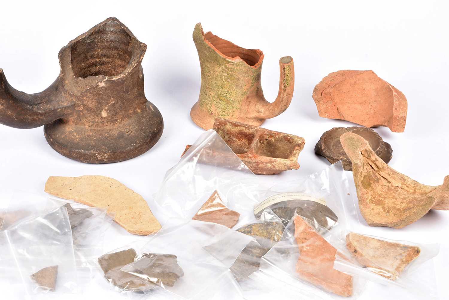 Lot 94 - A quantity of Roman and later pottery and artefacts
