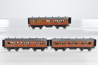 Lot 517 - Bassett Lowke O Gauge, Bing for Bassett Lowke, LMS 1924 series, 2 x first and 1 x third brake