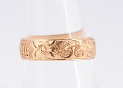 Lot 2 - A 14k gold patterned wedding band