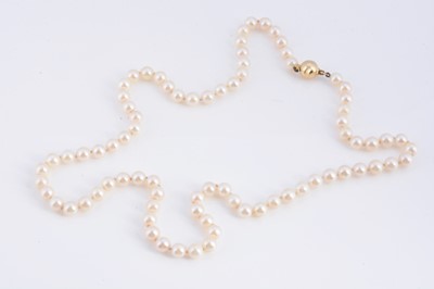 Lot 15 - A uniform knotted cultured pearl necklace, with 18k gold clasp
