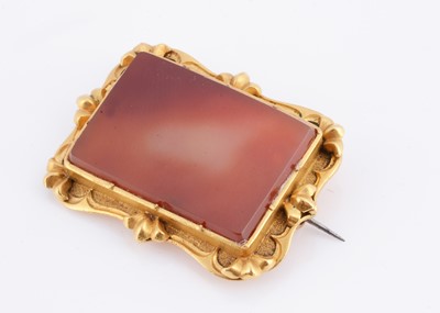 Lot 22 - An antique carnelian gilt framed brooch