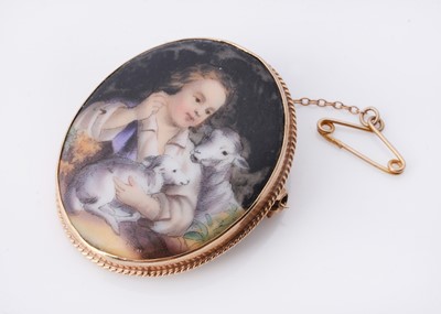 Lot 35 - An 9ct gold oval porcelain brooch