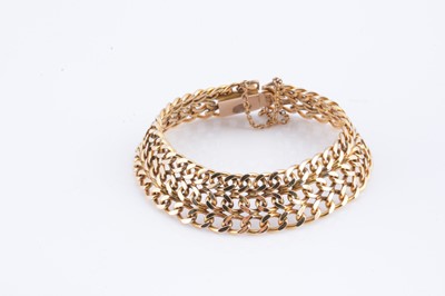 Lot 36 - A yellow metal gold three strand curb bracelet
