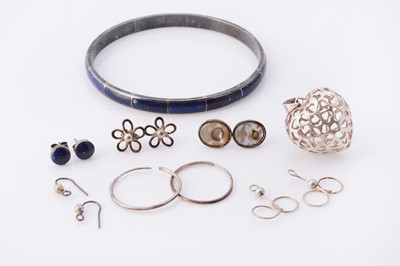 Lot 52 - A silver lattice 3D heart pendant, together with a white metal & blue stone bangle