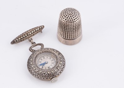Lot 96 - A white metal UNO fob watch pin
