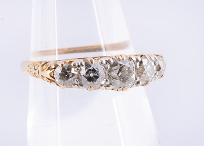 Lot 102 - An early 20th century five stone diamond ring