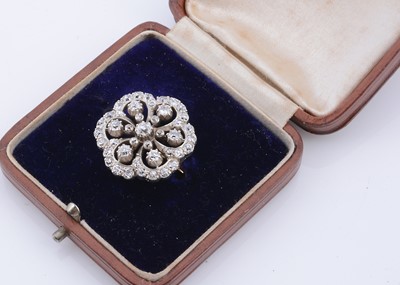 Lot 104 - An Edwardian diamond set floral brooch