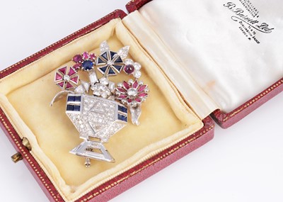 Lot 120 - An early 20th century platinum & gem set bouquet brooch, set with rubies, sapphire & diamonds