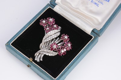 Lot 123 - A cocktail ruby & diamond floral double clip brooch