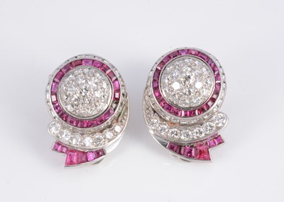 Lot 127 - A pair of early 20th century platinum diamond & ruby earrings clip back earrings