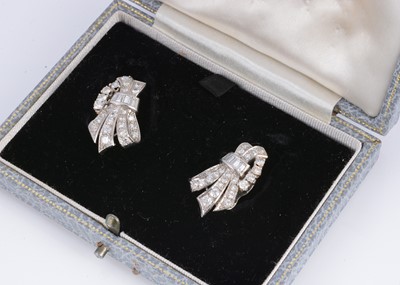 Lot 130 - A pair of Art Deco diamond set feather bow clip back earrings