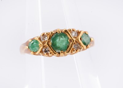Lot 156 - An Edwardian emerald & diamond 18ct gold half-hoop ring