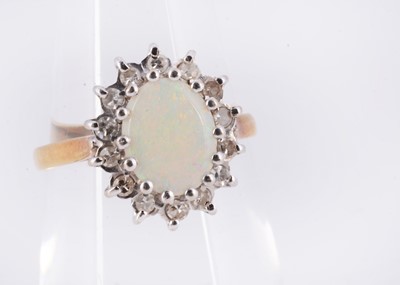 Lot 157 - A 18ct gold opal cluster dress ring