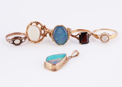 Lot 164 - A collection of five dress rings & opal pendant
