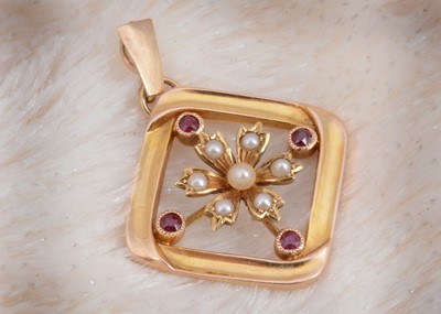 Lot 169 - A 15ct gold ruby and seed pearl drop pendant