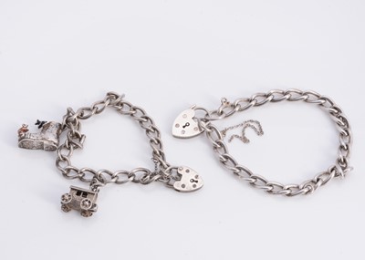 Lot 176 - Two silver curb bracelets with padlocks