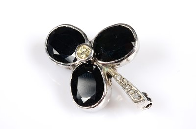 Lot 180 - A contemporary white gold sapphire & diamond clover leaf brooch