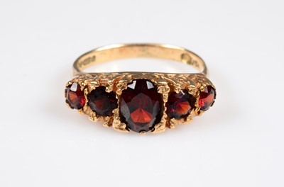 Lot 190 - A 9ct gold antique style boat shaped garnet dress ring