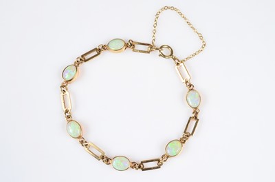 Lot 192 - An 9ct gold opal & rectangle linked baton bracelet