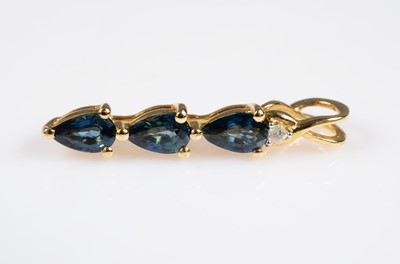Lot 194 - A contemporary 10k marked sapphire & diamond drop pendant