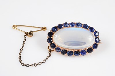 Lot 196 - A early 20th century moonstone & gem set oval brooch