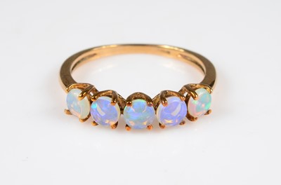 Lot 197 - A 9ct gold five stone opal dress ring