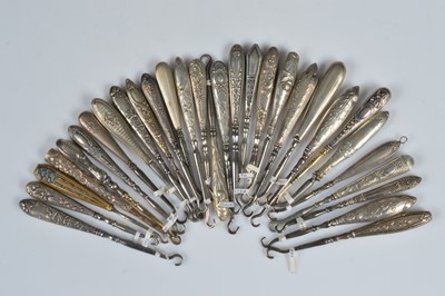 Lot 203 - Thirty small steel button or glove hooks