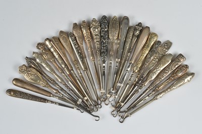 Lot 206 - Twenty six silver and white metal handled steel button hooks