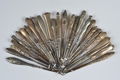 Lot 210 - Twenty seven silver and white metal handled steel button hooks
