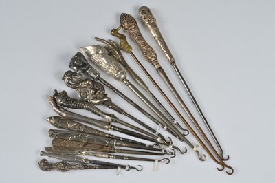 Lot 222 - Fifteen animal handled button hooks