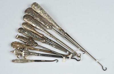 Lot 228 - Nine figural handled button hooks