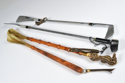 Lot 236 - Four large novelty shoehorns