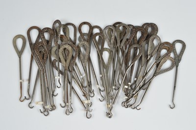 Lot 237 - A collection of steel advertising button hooks