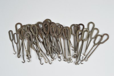 Lot 238 - A collection of steel advertising button hooks
