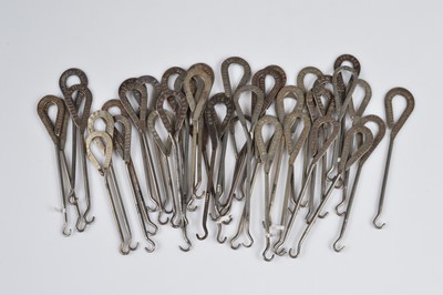 Lot 240 - A collection of steel advertising button hooks