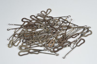 Lot 241 - A collection of steel advertising button hooks