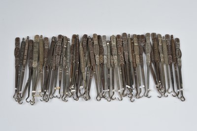 Lot 243 - A collection of steel advertising button hooks