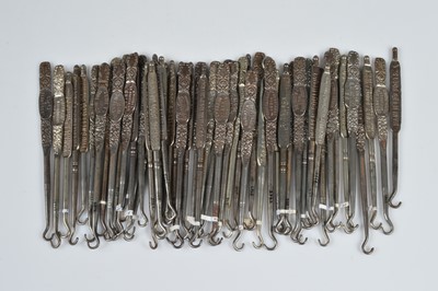 Lot 245 - A collection of steel advertising button hooks