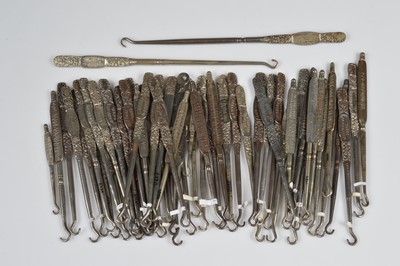 Lot 247 - A collection of steel advertising button hooks
