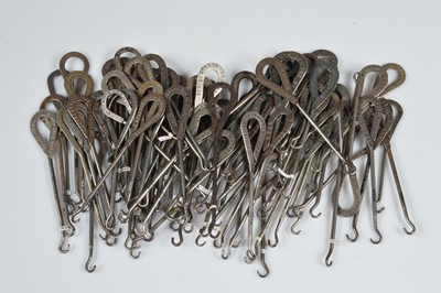 Lot 248 - A collection of steel advertising button hooks