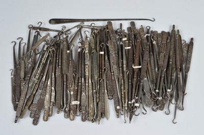 Lot 249 - A collection of steel advertising button hooks