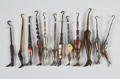 Lot 252 - A collection of twelve novelty steel and brass button hooks