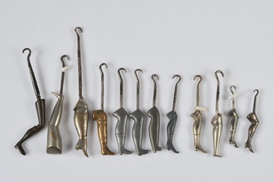 Lot 258 - A collection of late 19th and early 20th Century steel, lead and brass leg button hooks
