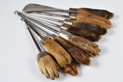Lot 260 - A quantity of trophy and taxidermy foot or paw mounted shoehorns