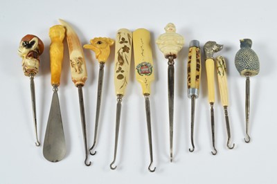Lot 261 - A collection of ten Victorian and later plastic and resin handled button hooks