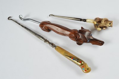 Lot 262 - Three novelty button hooks