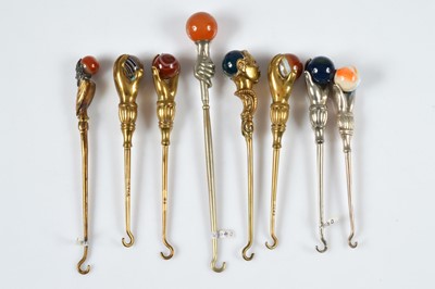 Lot 265 - A collection of Victorian and later brass and chromed novelty button hooks