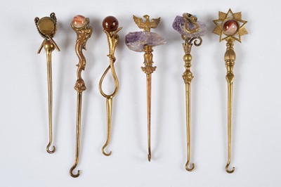 Lot 266 - Six gilt metal novelty button hooks